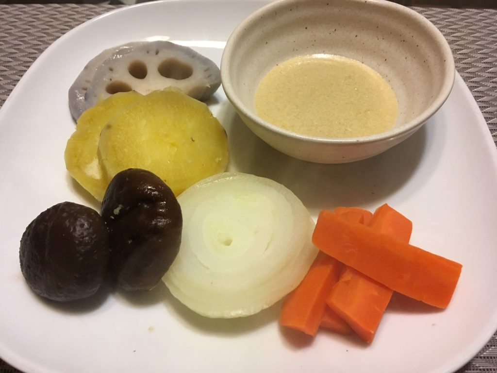 Boiled veges with Bagna cauda sauce on table