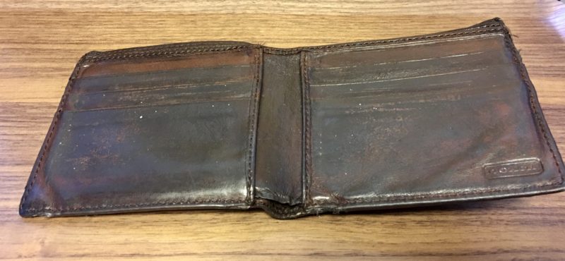  Image of the inside of a COACH wallet before repair