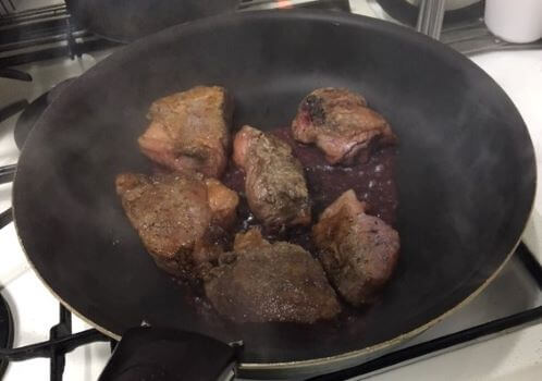 Image Browning the beef in a frying pan