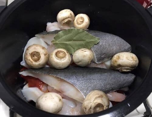 Image Put in the cod, squid, and mushrooms